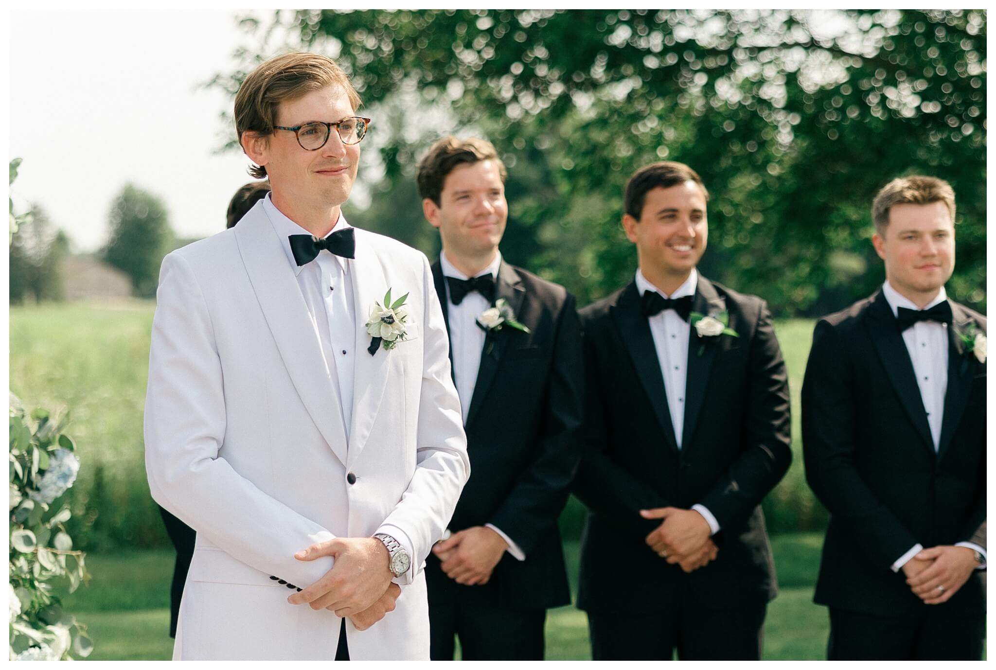 refined black and white wedding at a white barn etre farms in saint joseph michigan by josh and andrea photography 