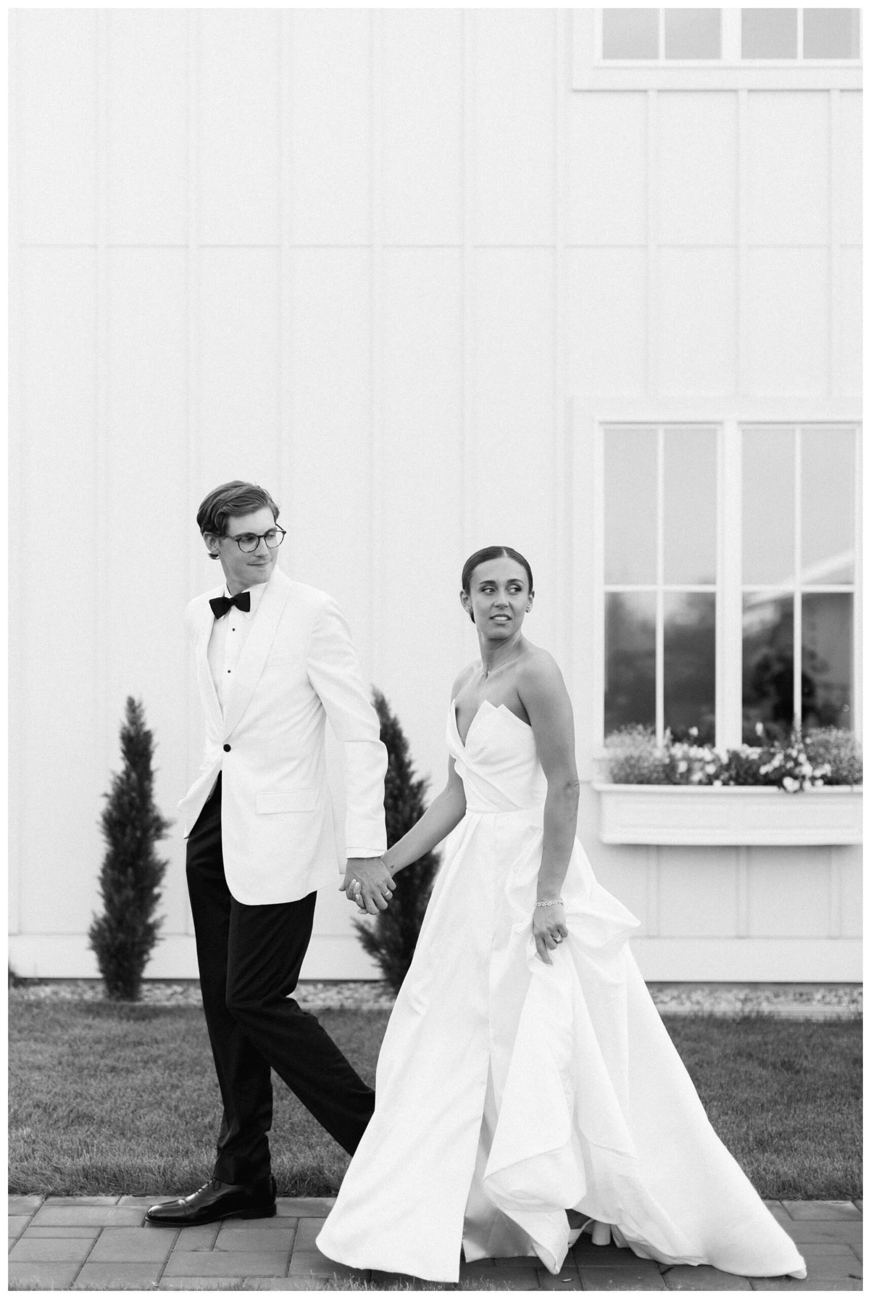 refined black and white wedding at a white barn etre farms in saint joseph michigan by josh and andrea photography 