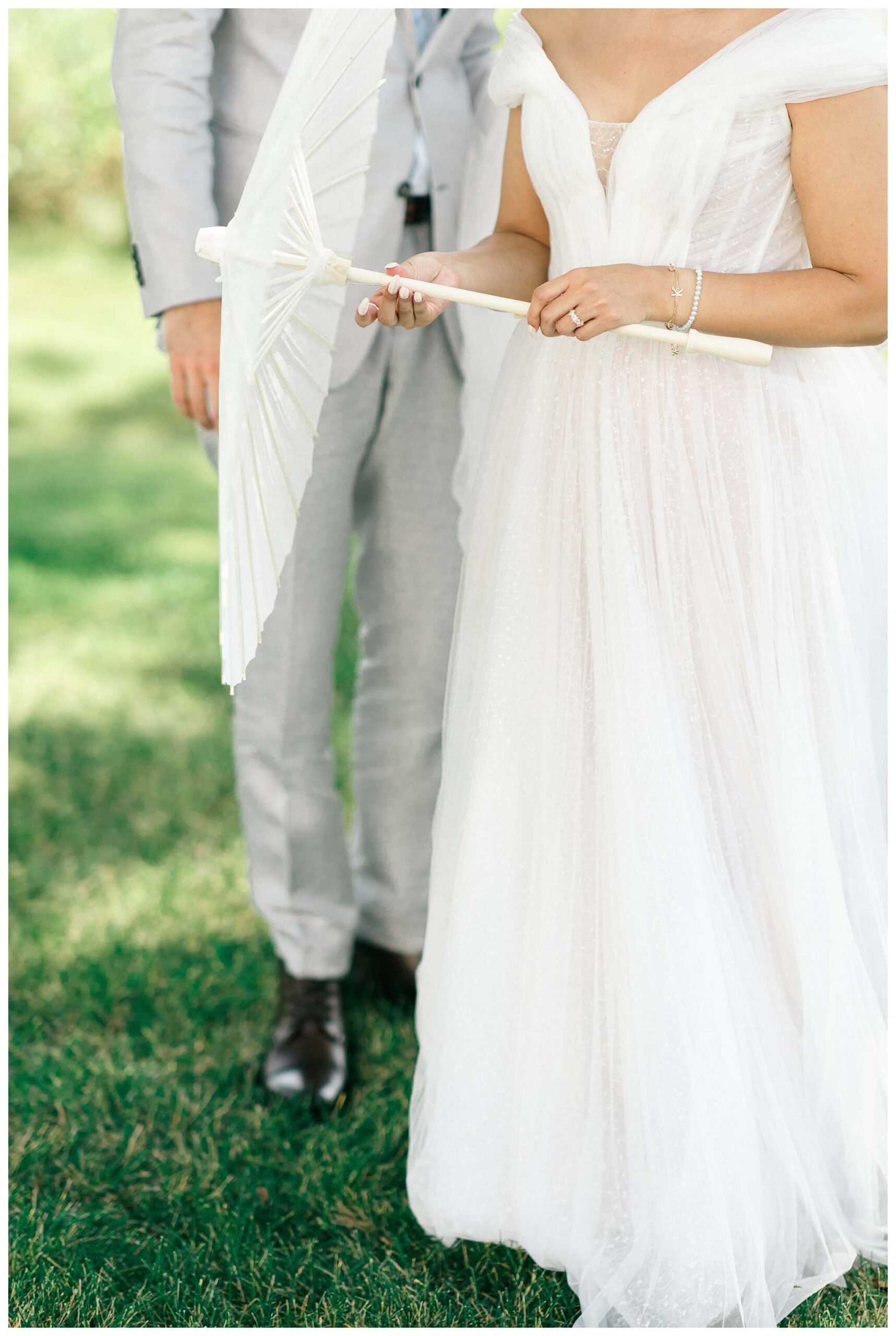 white barn wedding with parasols at etre farms in saint joseph michigan by josh and andrea photography