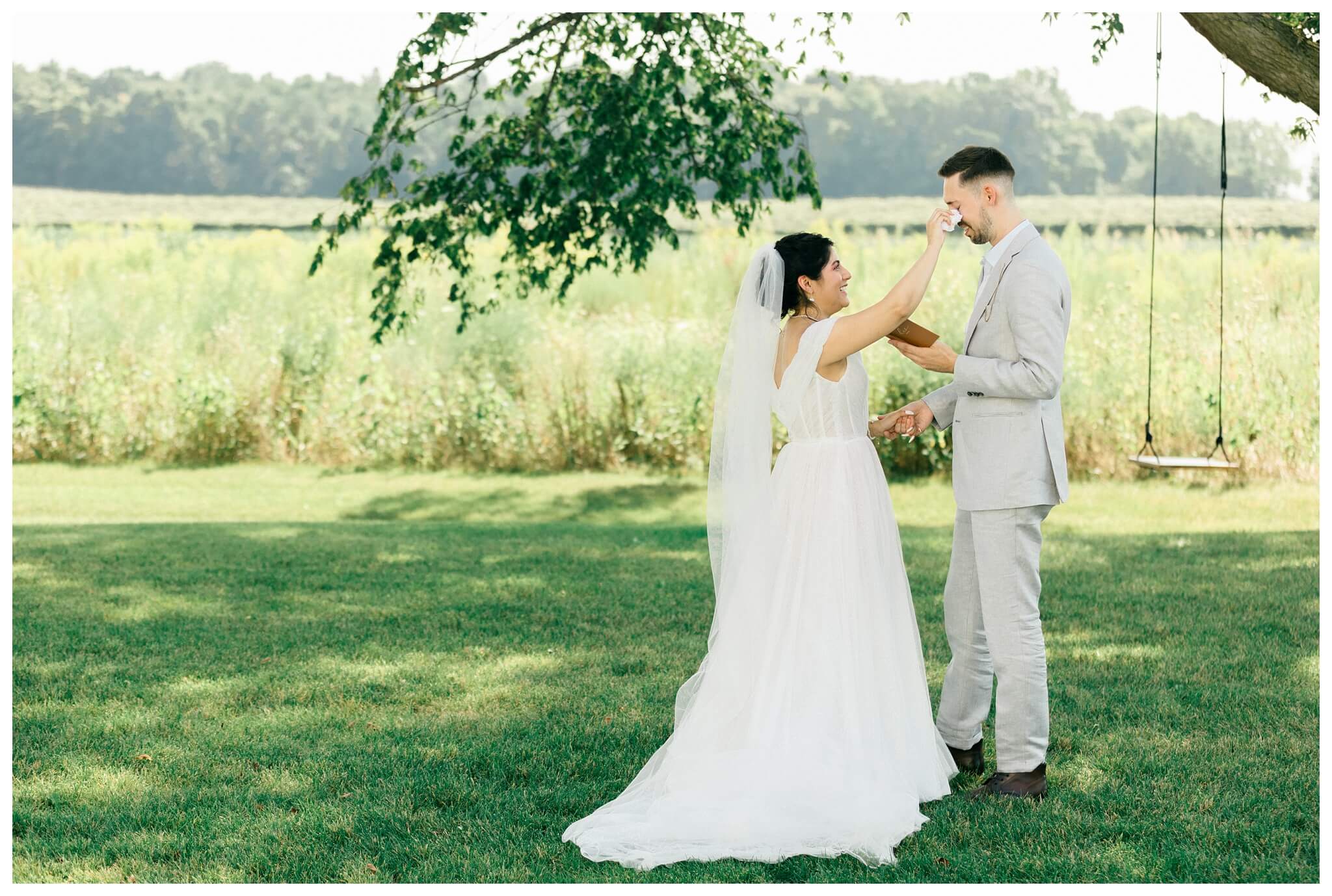 white barn wedding with parasols at etre farms in saint joseph michigan by josh and andrea photography