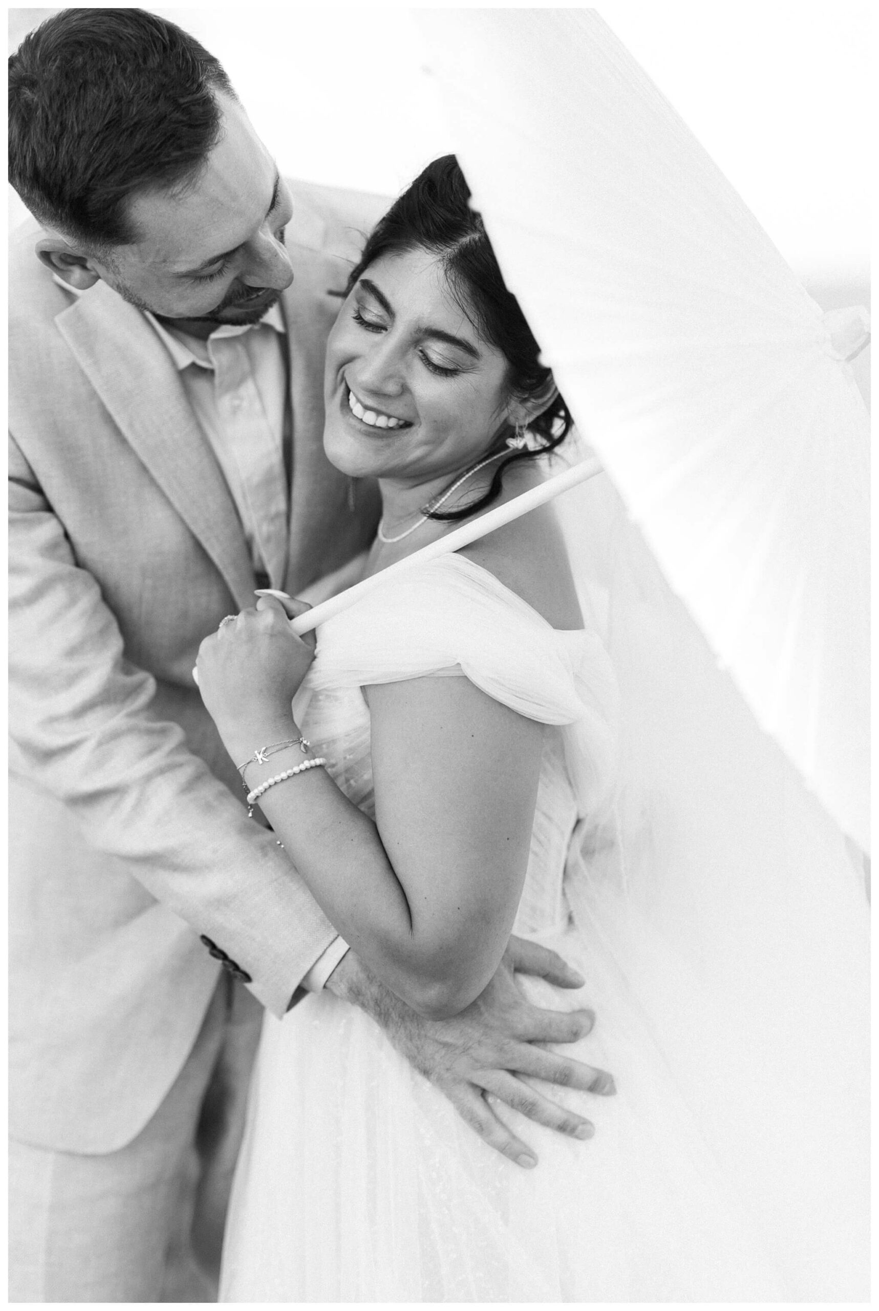 white barn wedding with parasols at etre farms in saint joseph michigan by josh and andrea photography