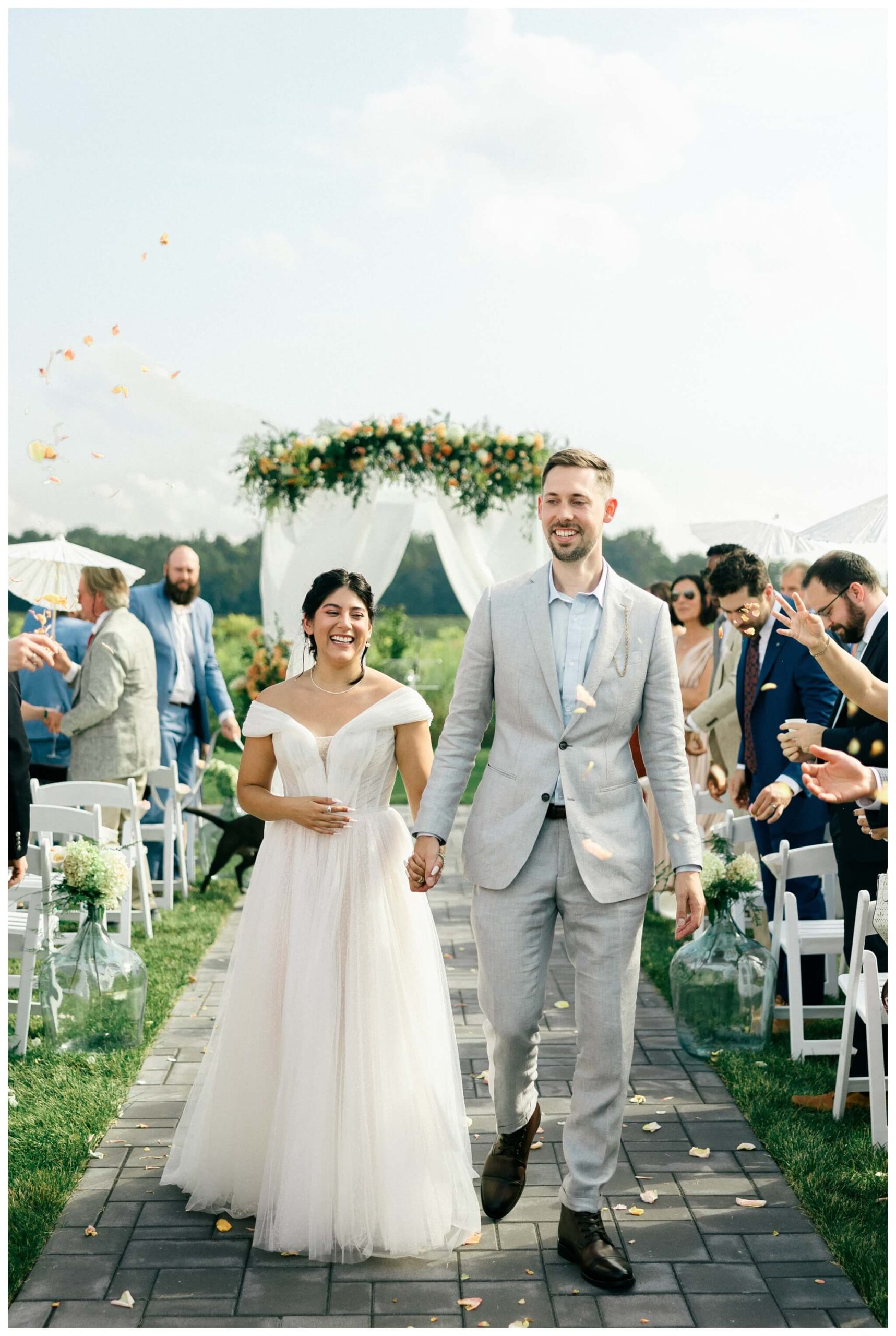 white barn wedding with parasols at etre farms in saint joseph michigan by josh and andrea photography