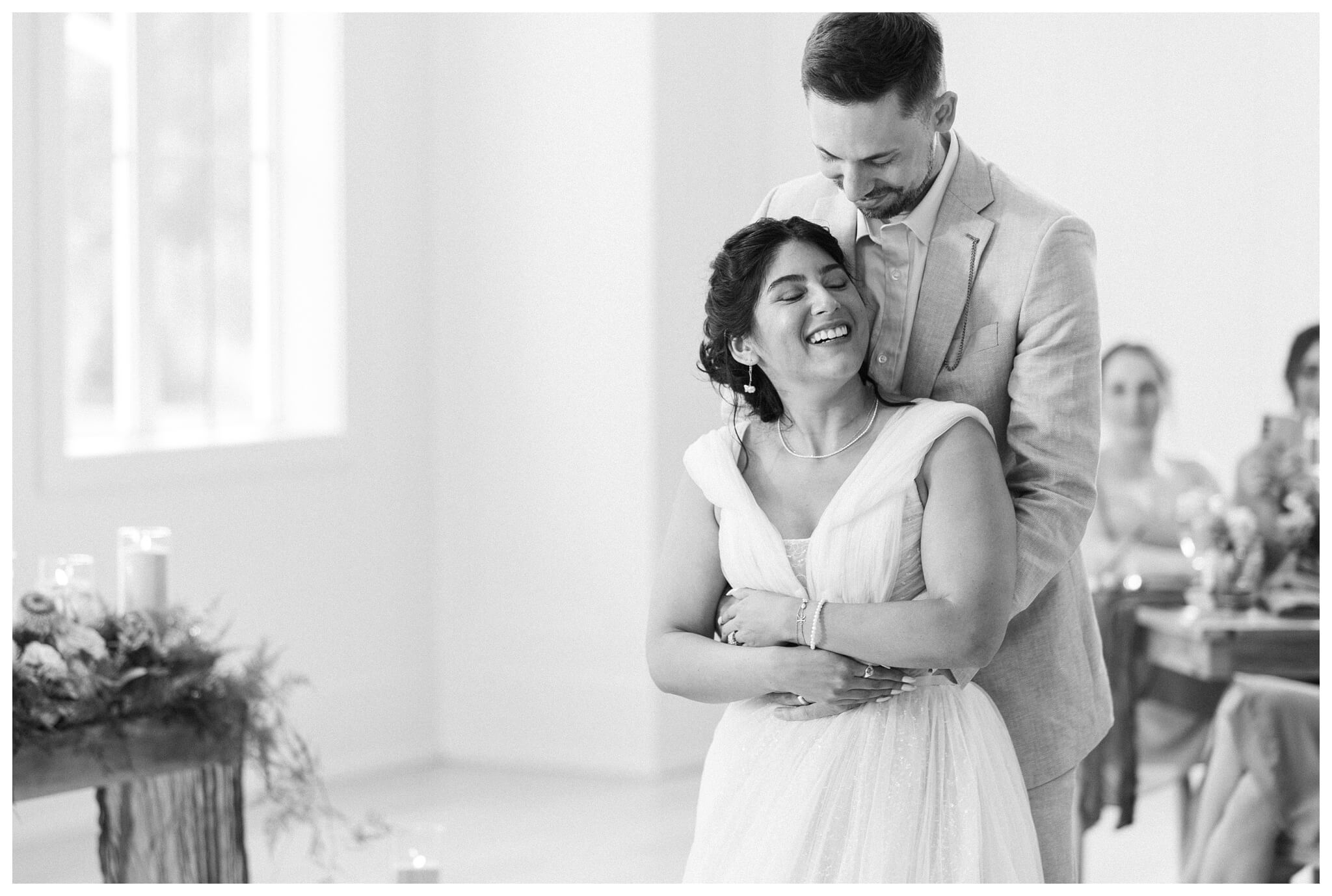 white barn wedding with parasols at etre farms in saint joseph michigan by josh and andrea photography