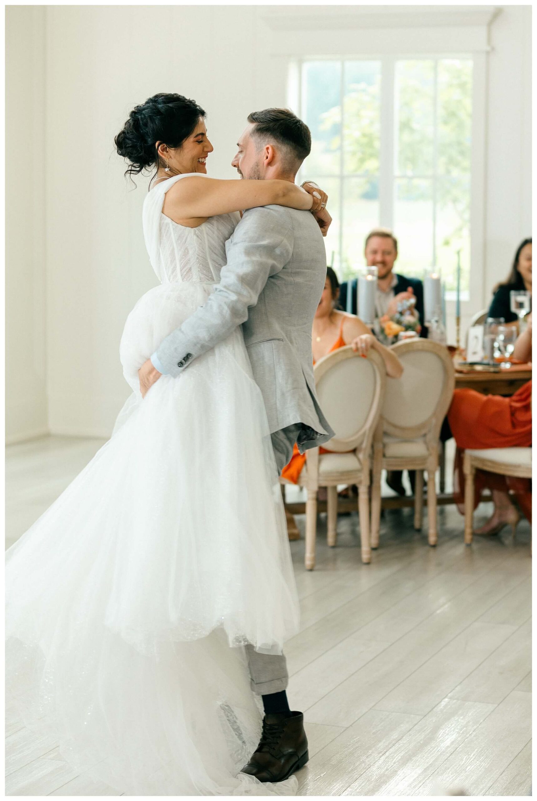 white barn wedding with parasols at etre farms in saint joseph michigan by josh and andrea photography