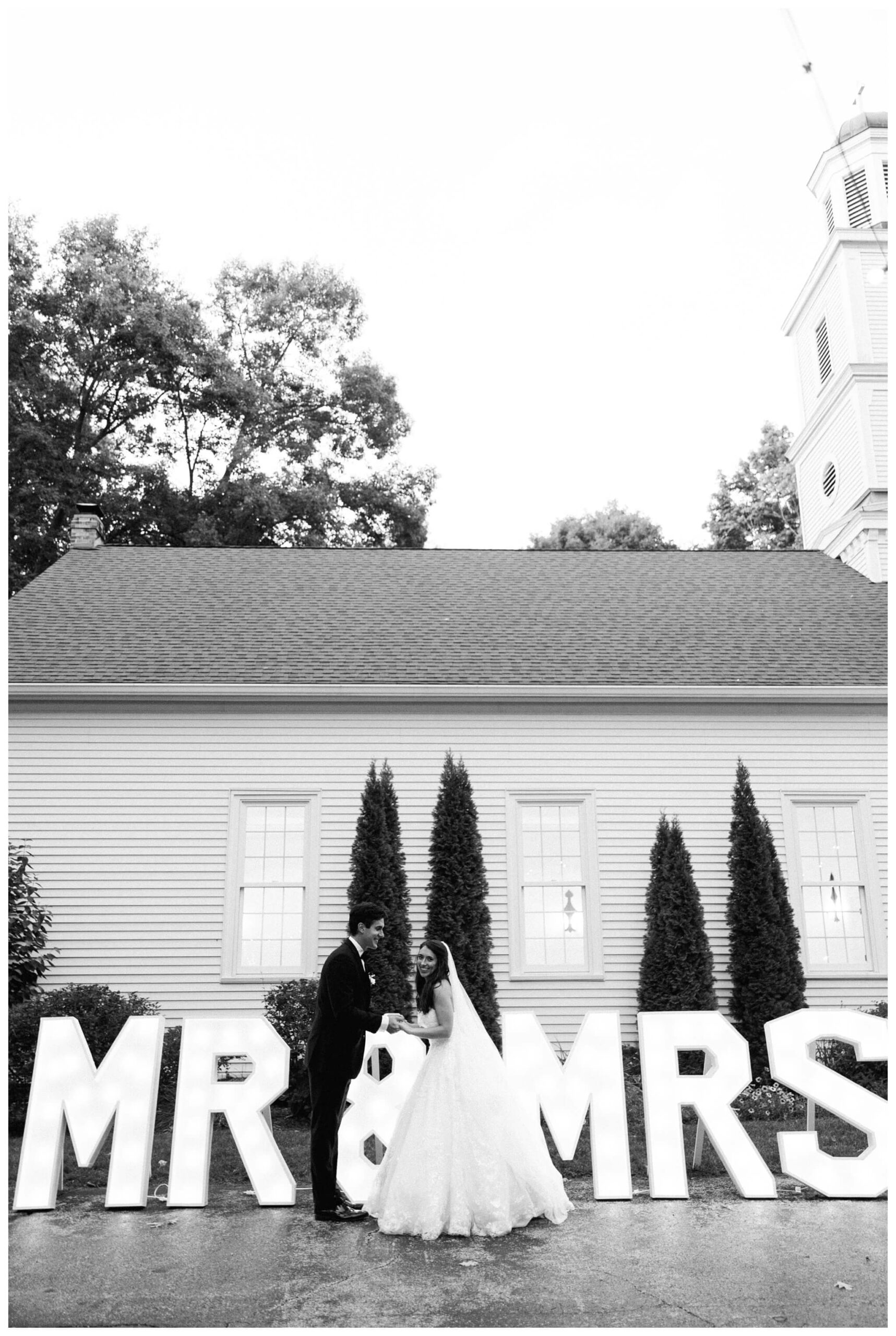 romantic white chapel wedding in niles michigan at morris estate with classic car by josh and andrea photography