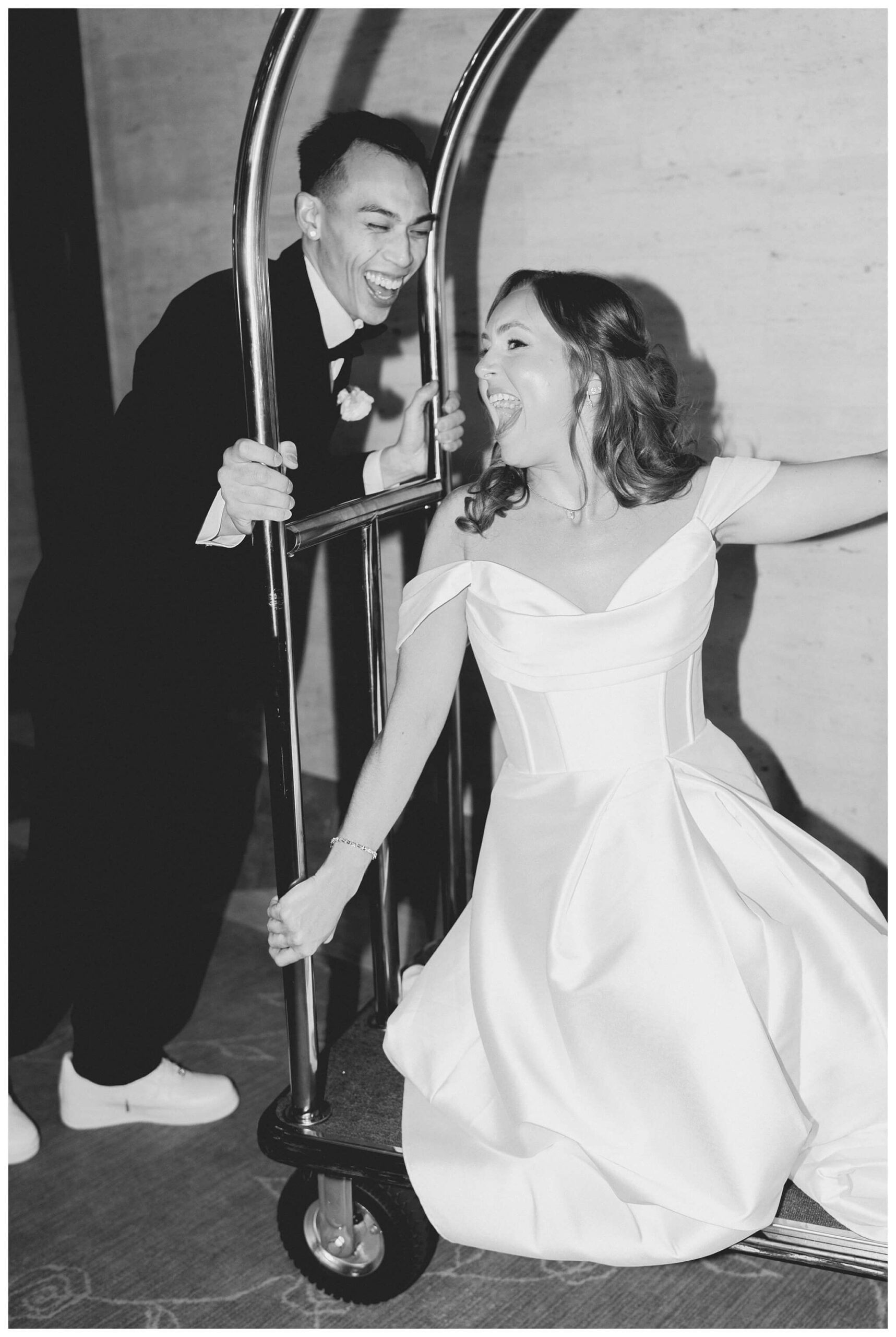 romantic timeless black tie wedding at saint johns resort with a luggage cart near detroit michigan by josh and andrea photography 