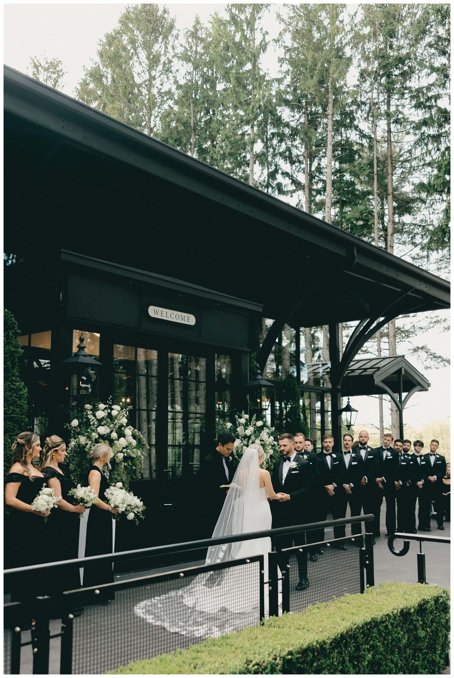iconic black and white wedding in a forest at shepherds hollow gold club near detroit michigan by josh and andrea photography 