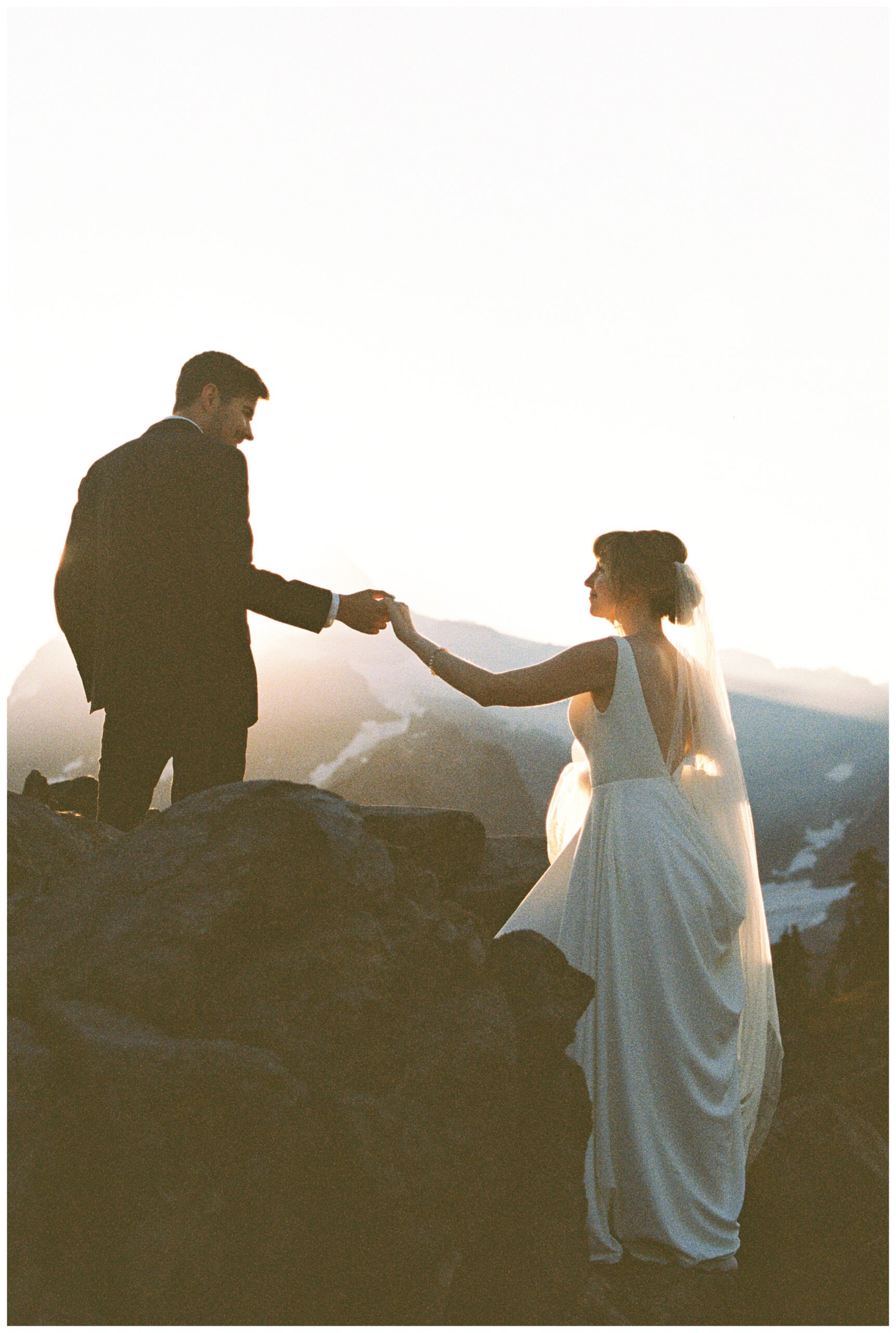 bride and groom share first look at majestic mountain wedding near deming washington by josh and andrea photography