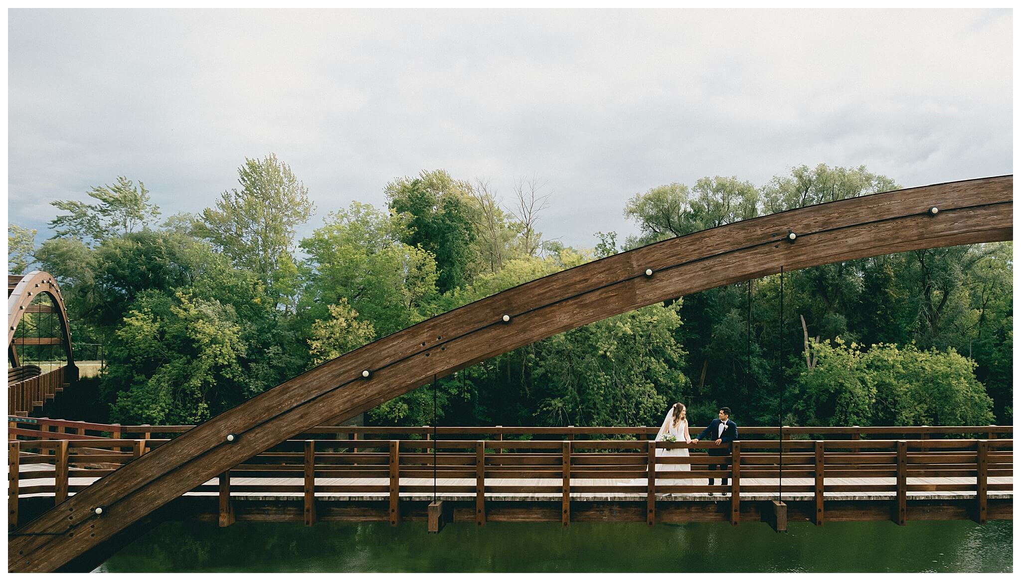 beautiful wedding photography near the Tridge at the H Hotel in midland michigan by josh and andrea photography