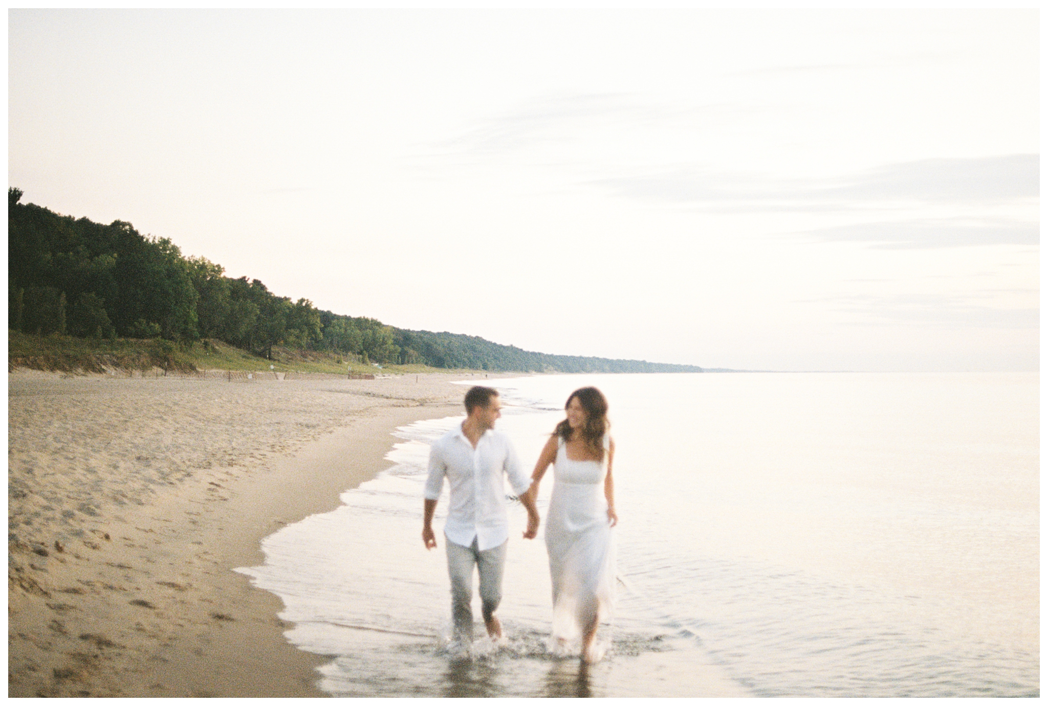 beautiful evening beach lakeside engagement shoot at warren dunes state park near new buffalo michigan by josh and andrea photography