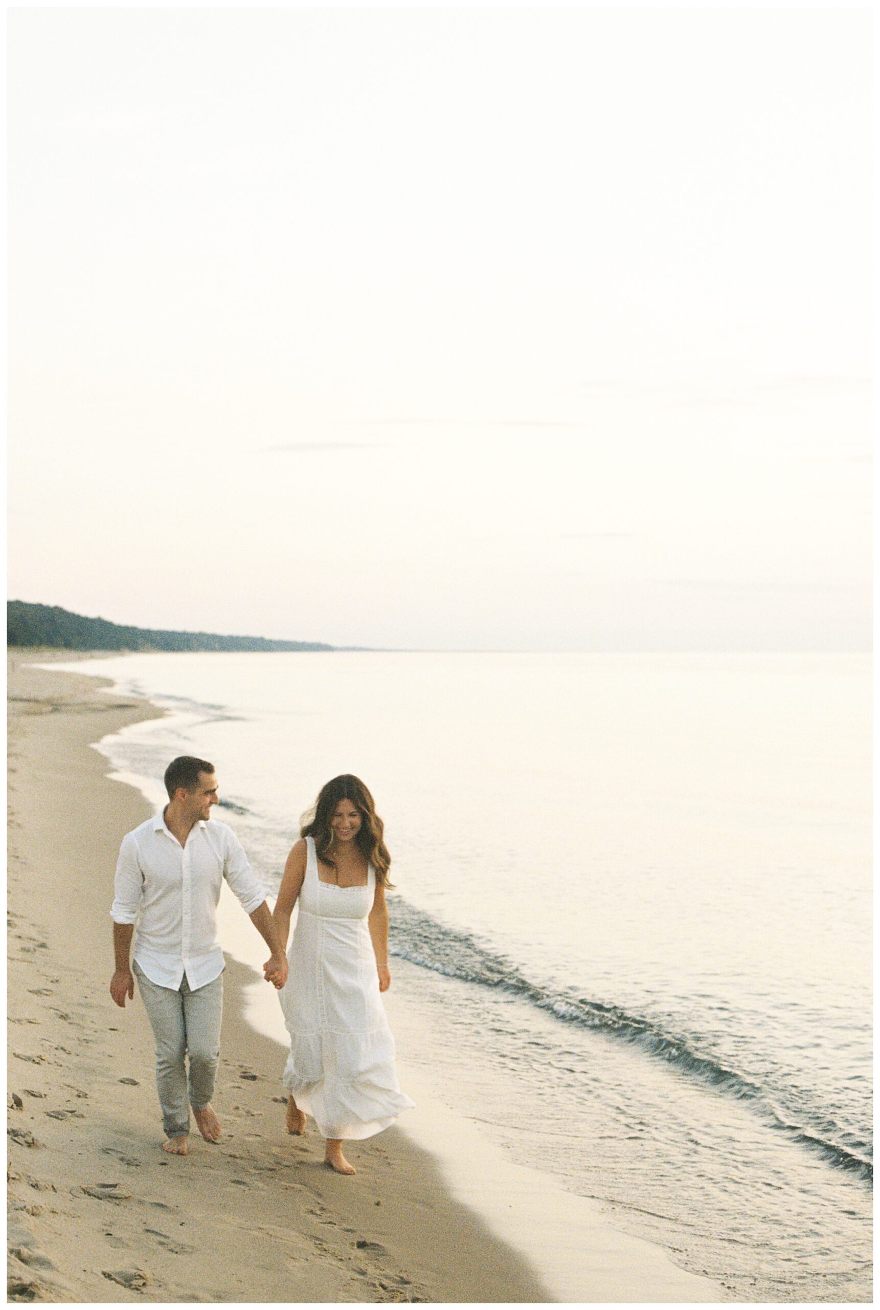 beautiful evening beach lakeside engagement shoot at warren dunes state park near new buffalo michigan by josh and andrea photography