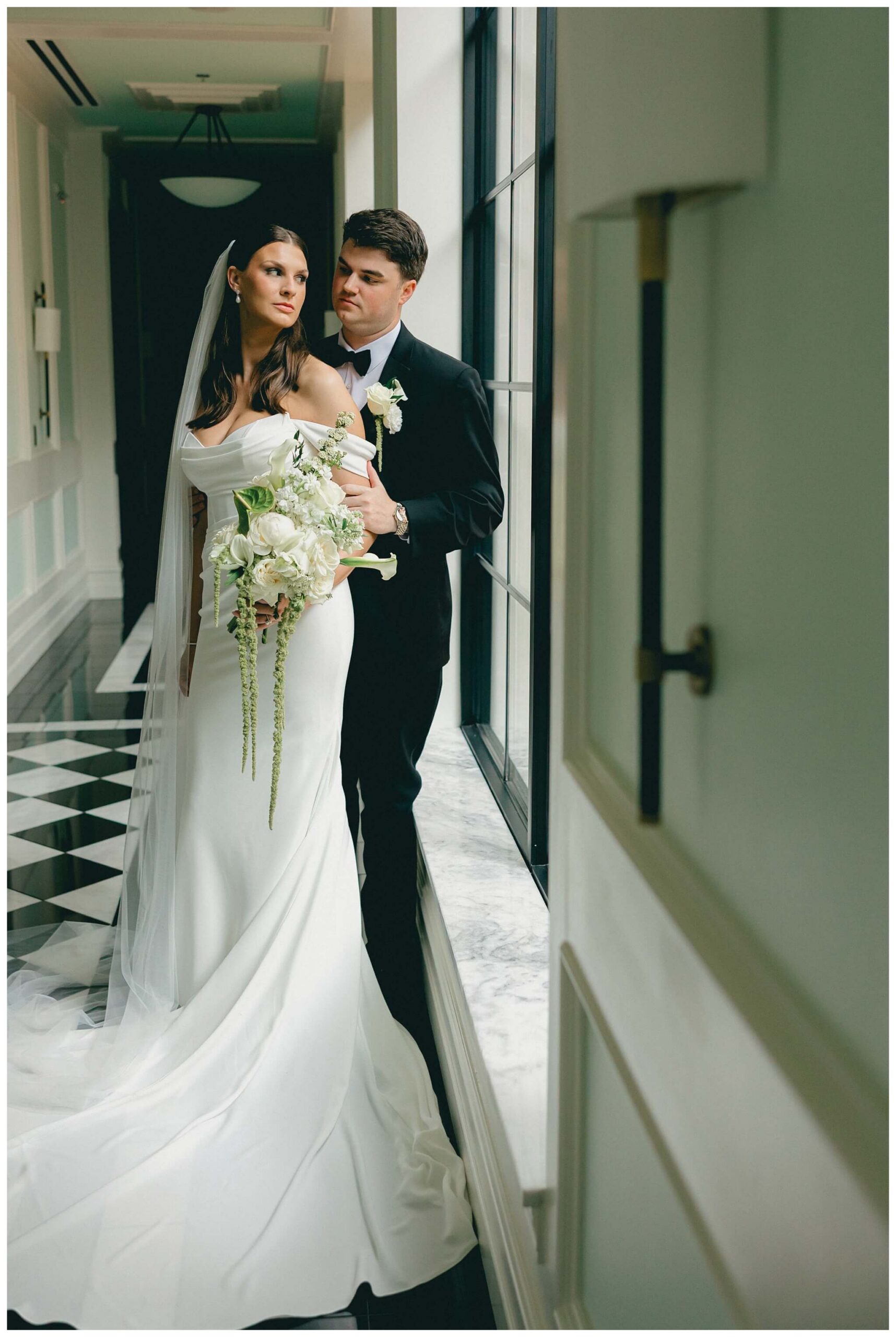 a bride and groom romantically standing in the hallway at Shepherd's Hollow on their wedding day photographed by josh and andrea photography 
