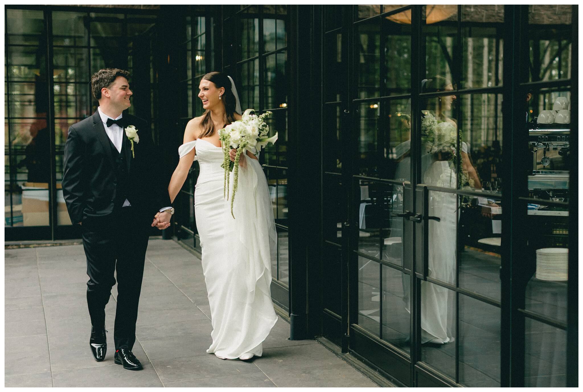 bride and groom taking a walk during their first look Shepherd's Hollow on their wedding day photographed by josh and andrea photography 