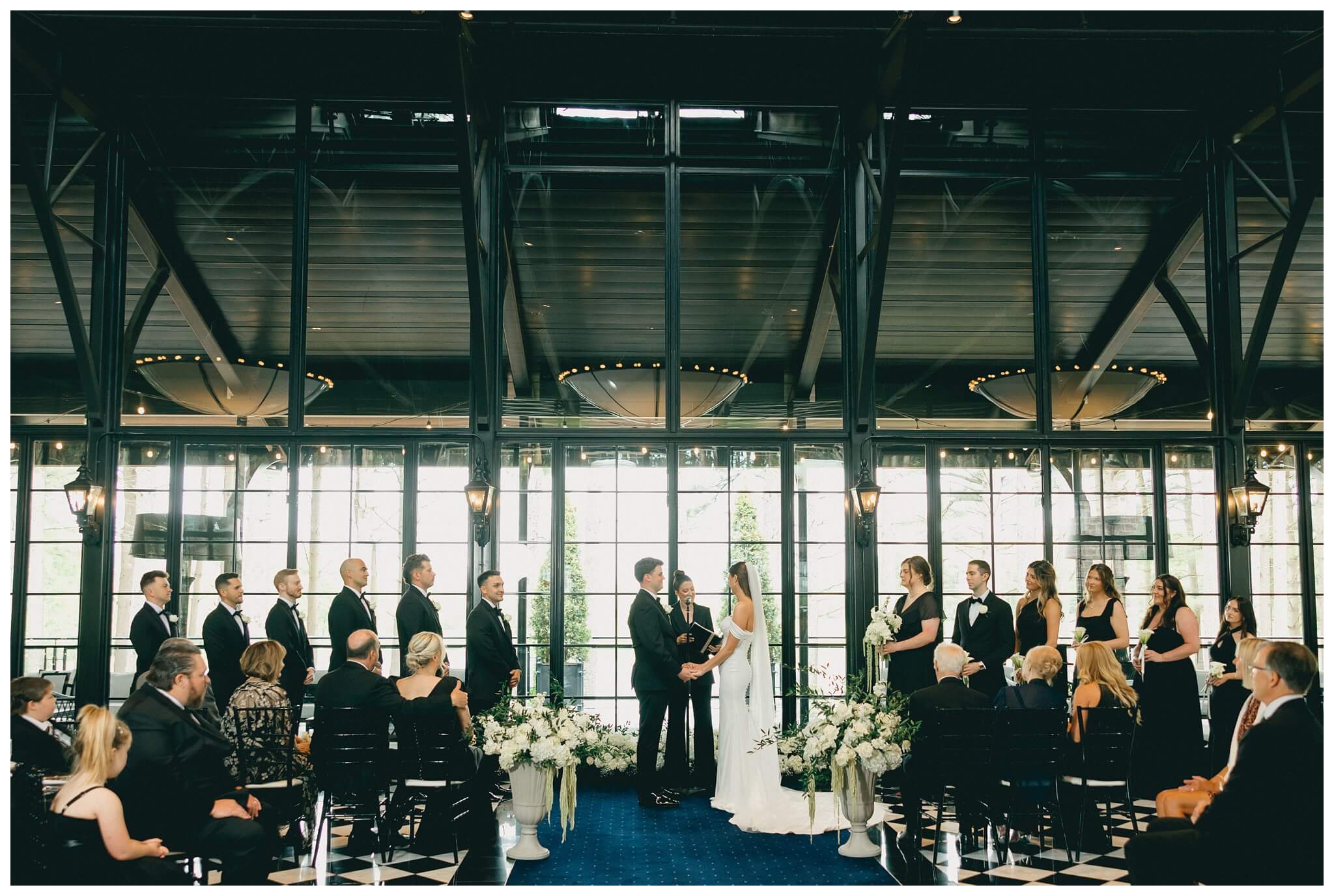 indoor ceremony at Shepherd's Hollow on a rainy wedding day photographed by josh and andrea photography 