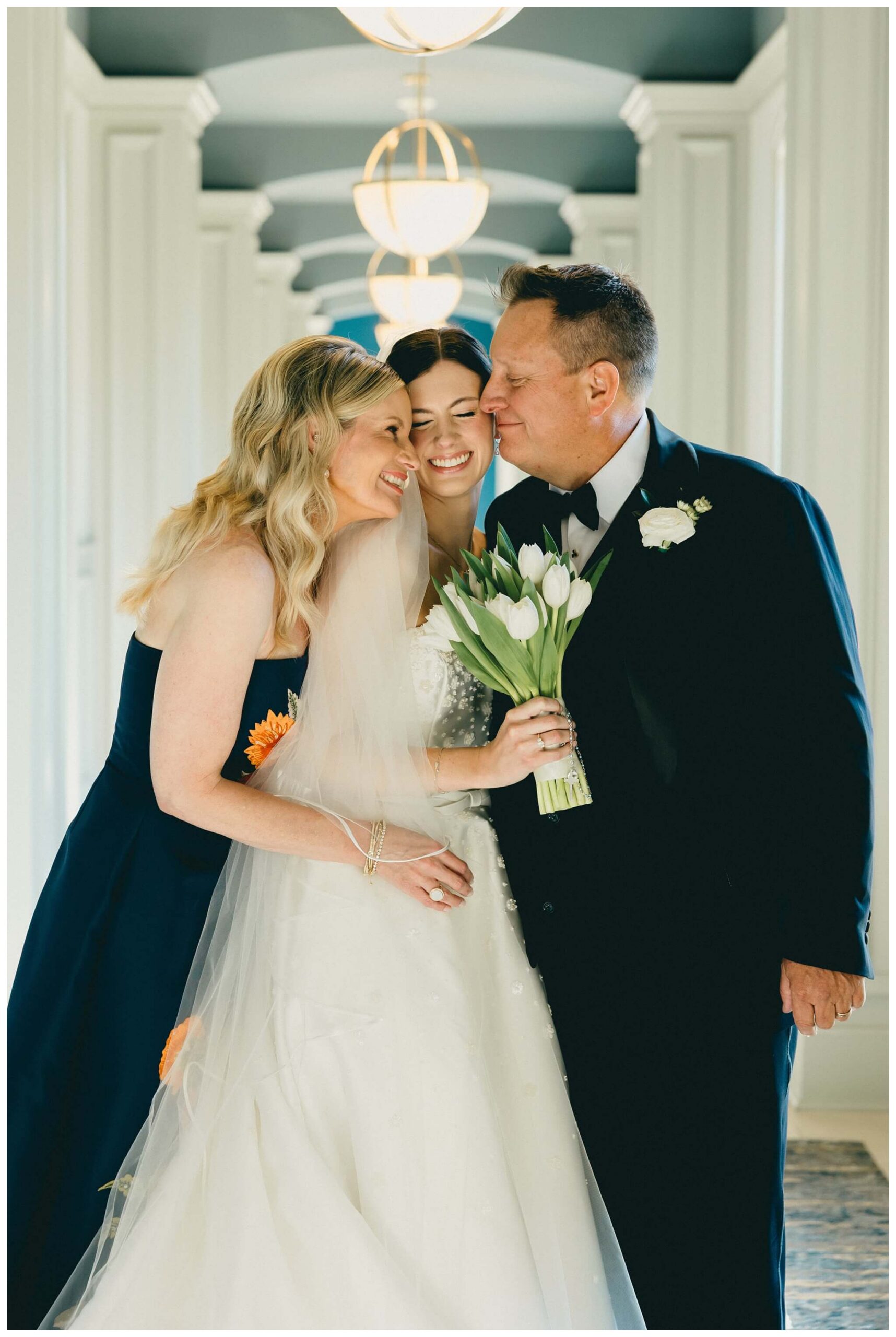 bride with mother and father at Notre dame indiana by josh and andrea photography