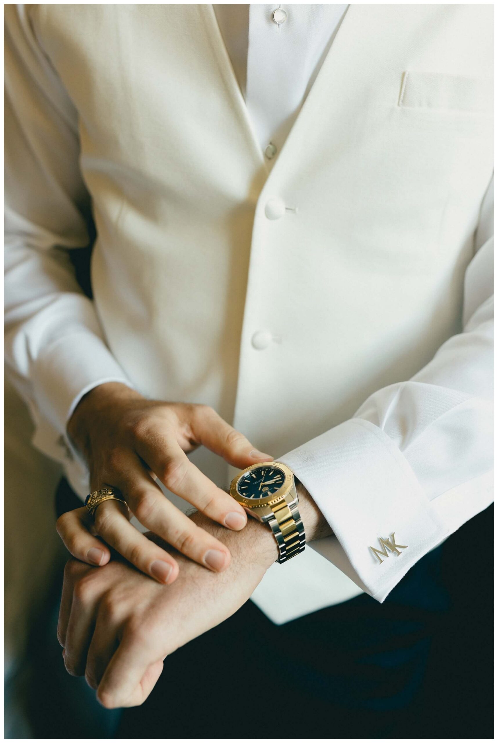 groom getting ready in the morris inn at Notre dame indiana by josh and andrea photography