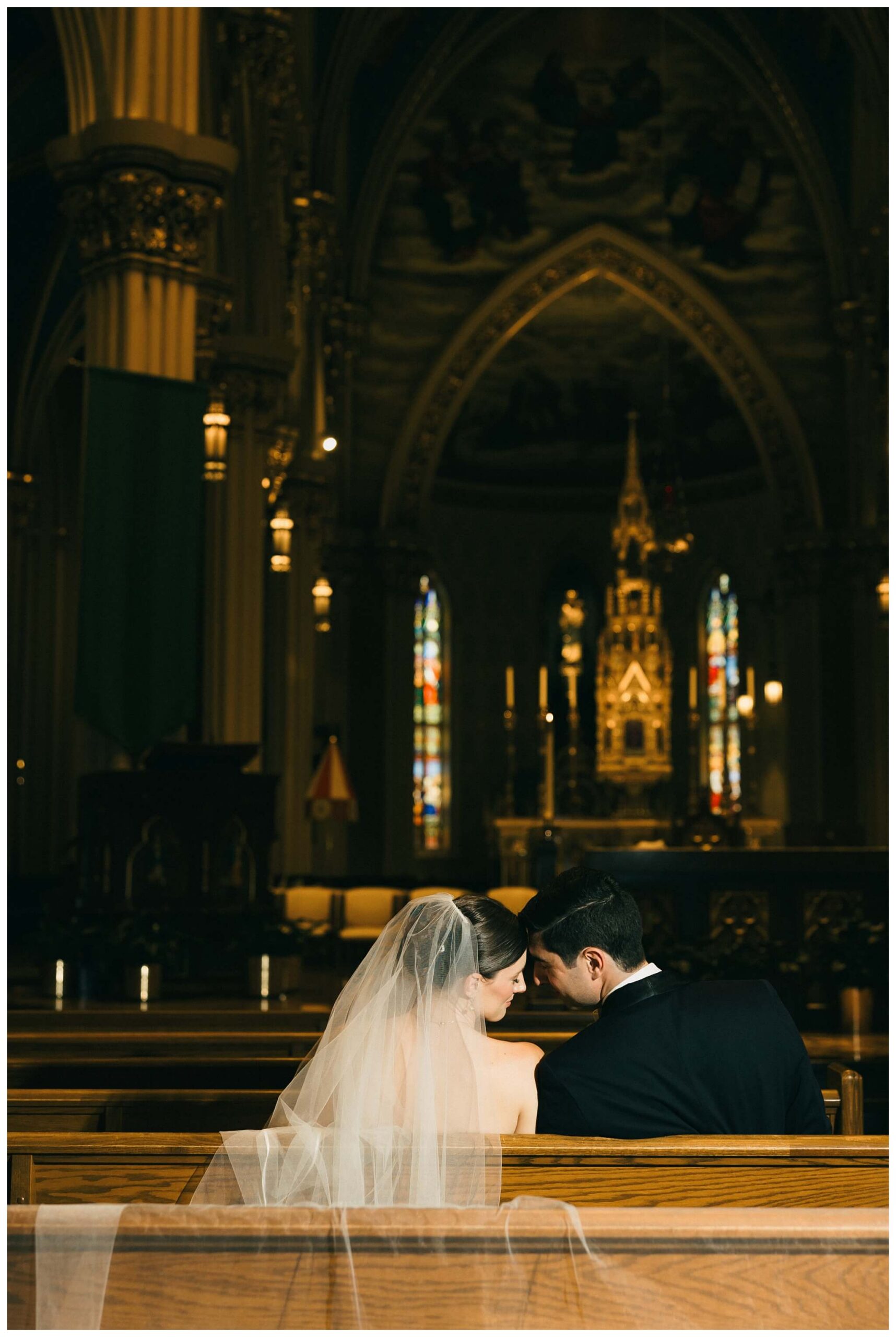 bride and groom portraits in the basilica at Notre dame indiana by josh and andrea photography