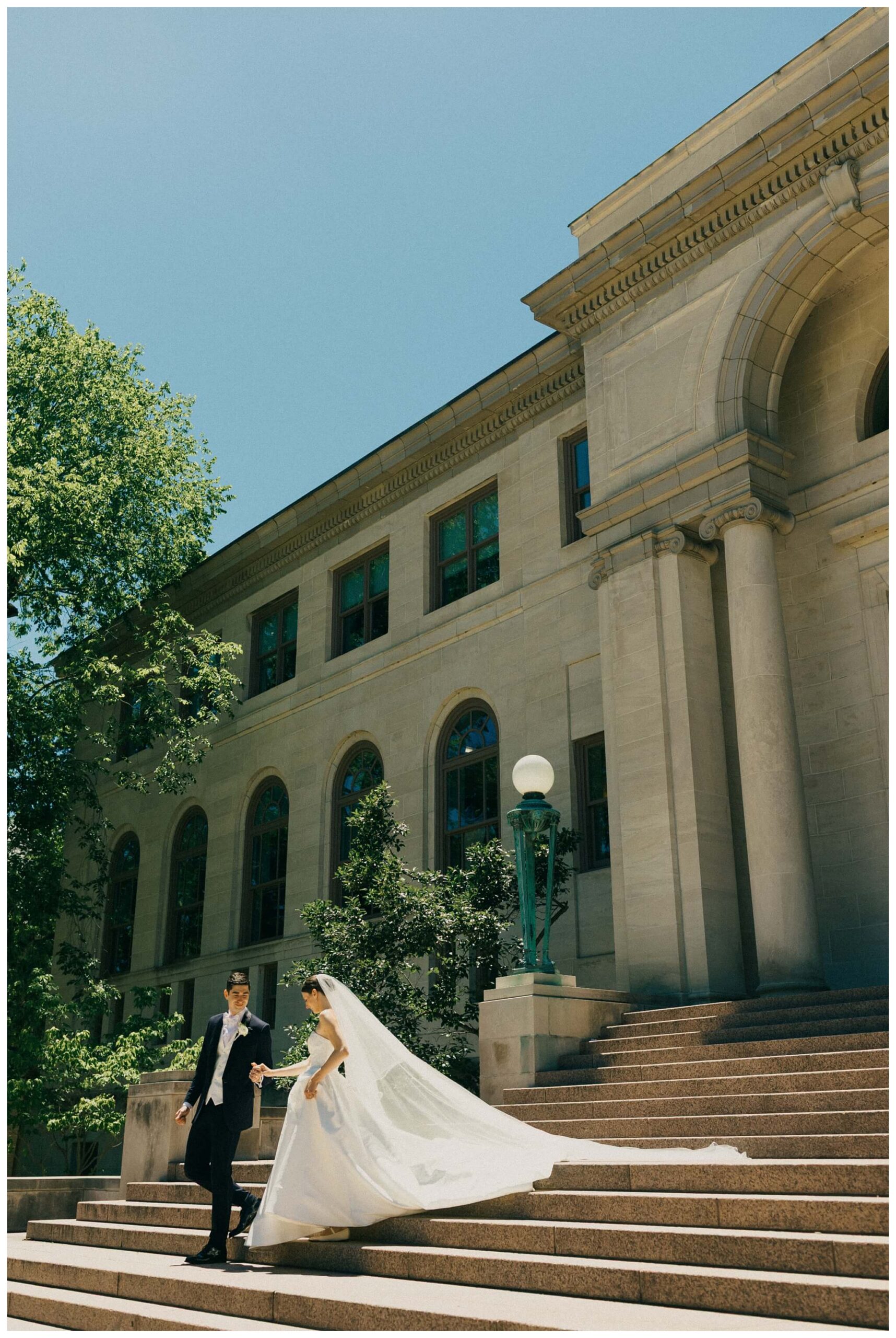 sunny bride and groom portrait at Notre dame indiana by josh and andrea photography