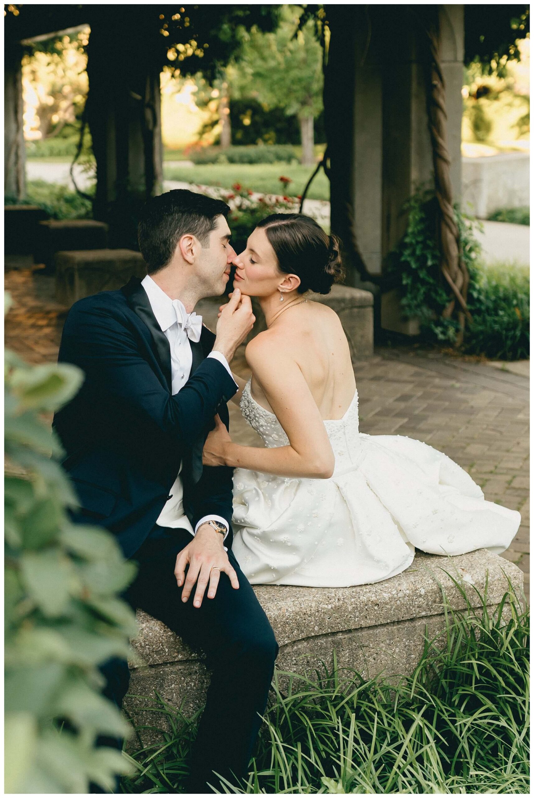 bride and groom golden hour golden hour portraits near the law school at Notre dame indiana by josh and andrea photography