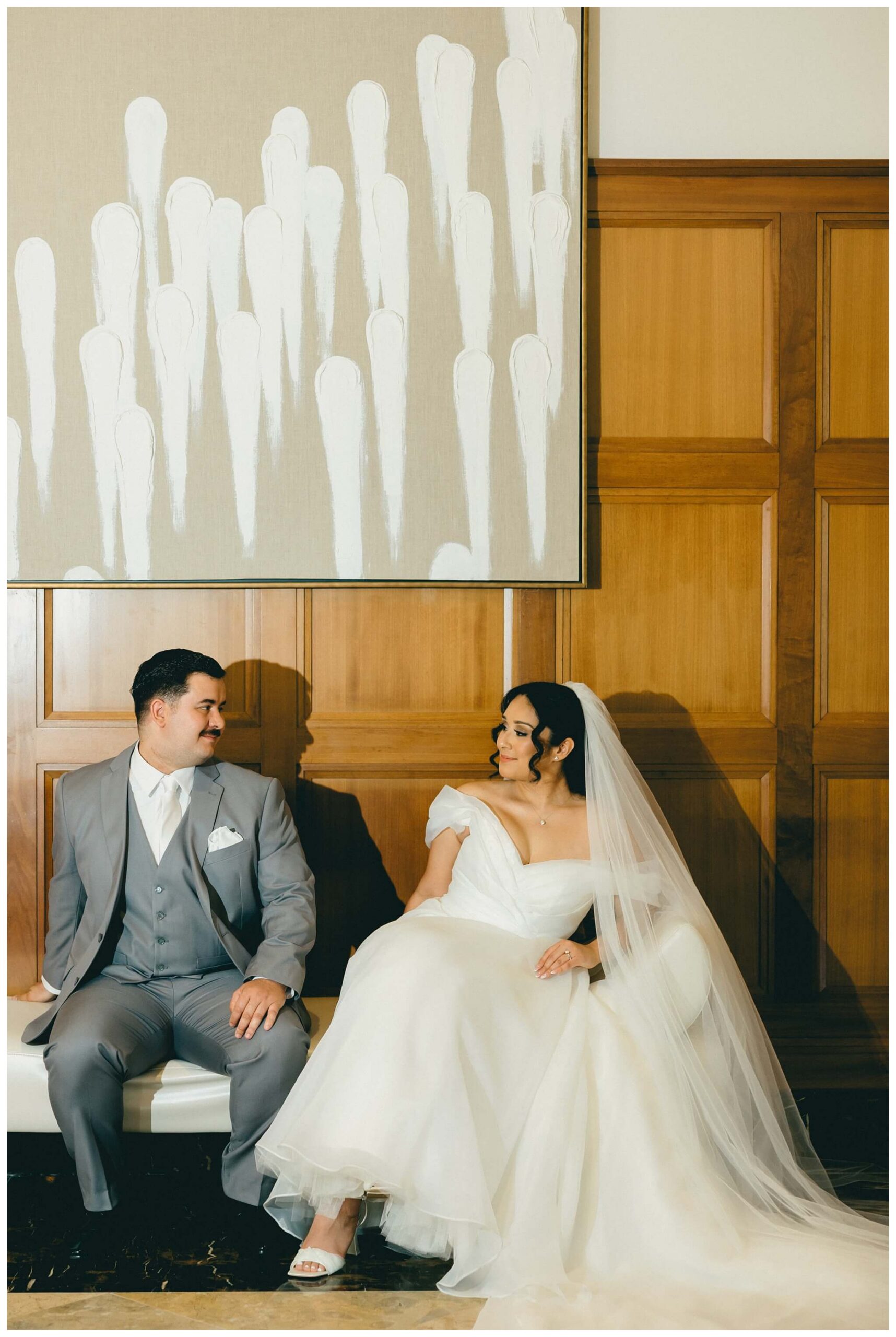bride and groom in the hallway at royal park hotel in rochester michigan by josh and andrea photography