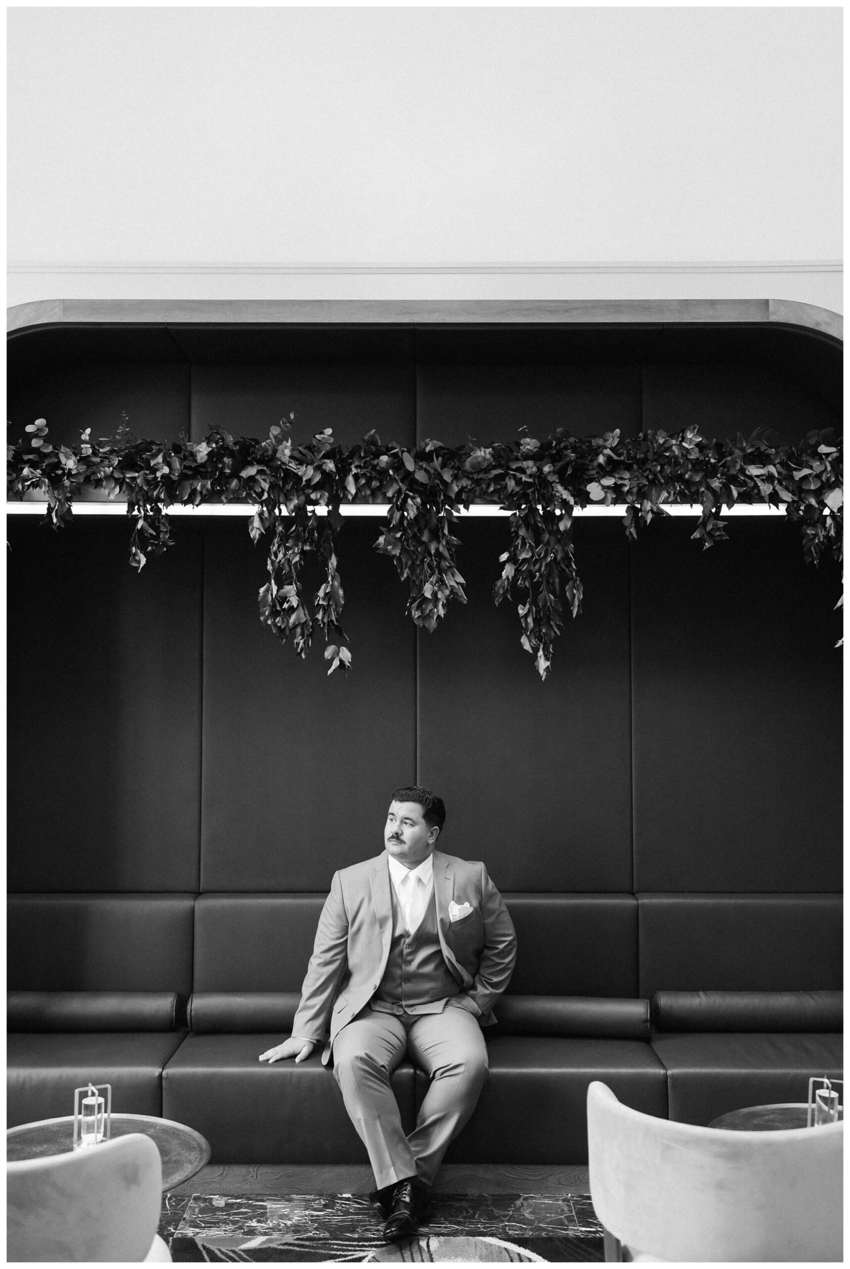 groom getting ready at royal park hotel in rochester michigan by josh and andrea photography 