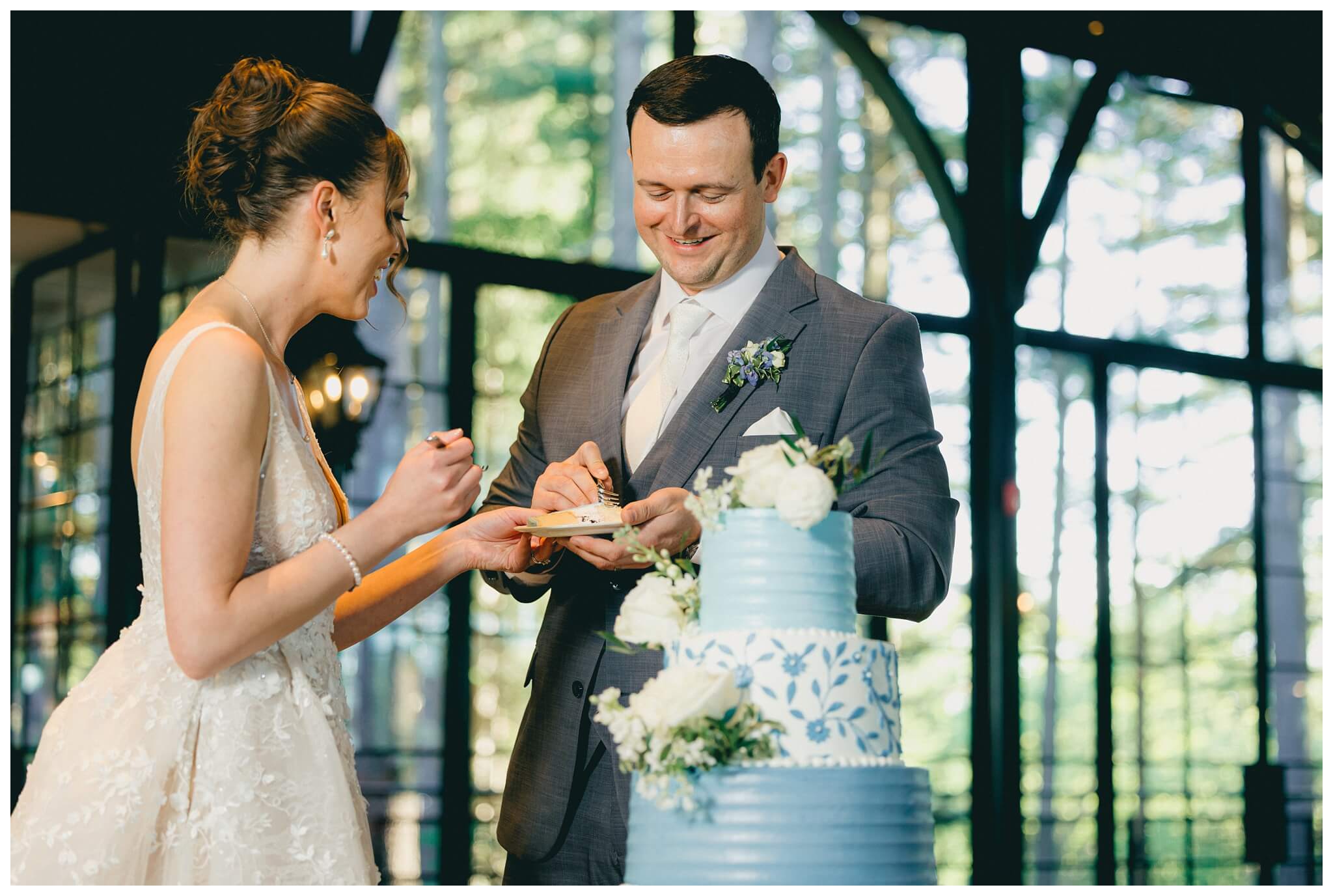 bride and groom cake cutting at shepherd's hollow golf club in clarkston michigan by josh and andrea photography 