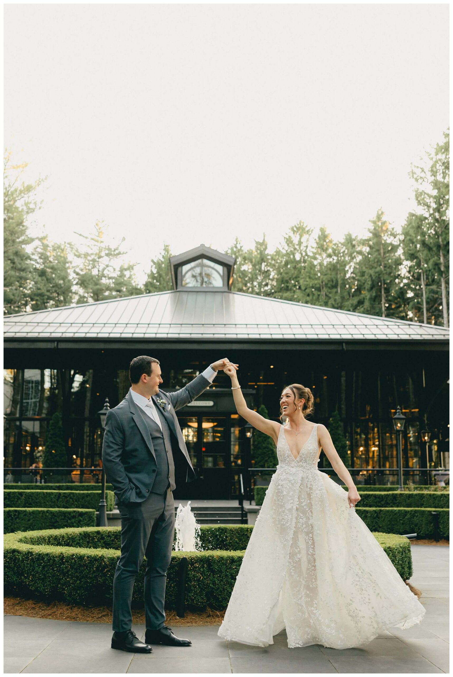 bride and groom dancing and spinning at shepherd's hollow golf club in clarkston michigan by josh and andrea photography 