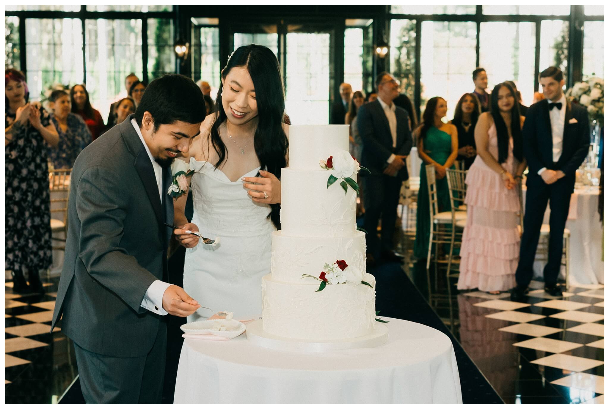 bride and groom cutting cake at reception at Shepherd's hollow golf club near clarkston michigan by josh and andrea photography 