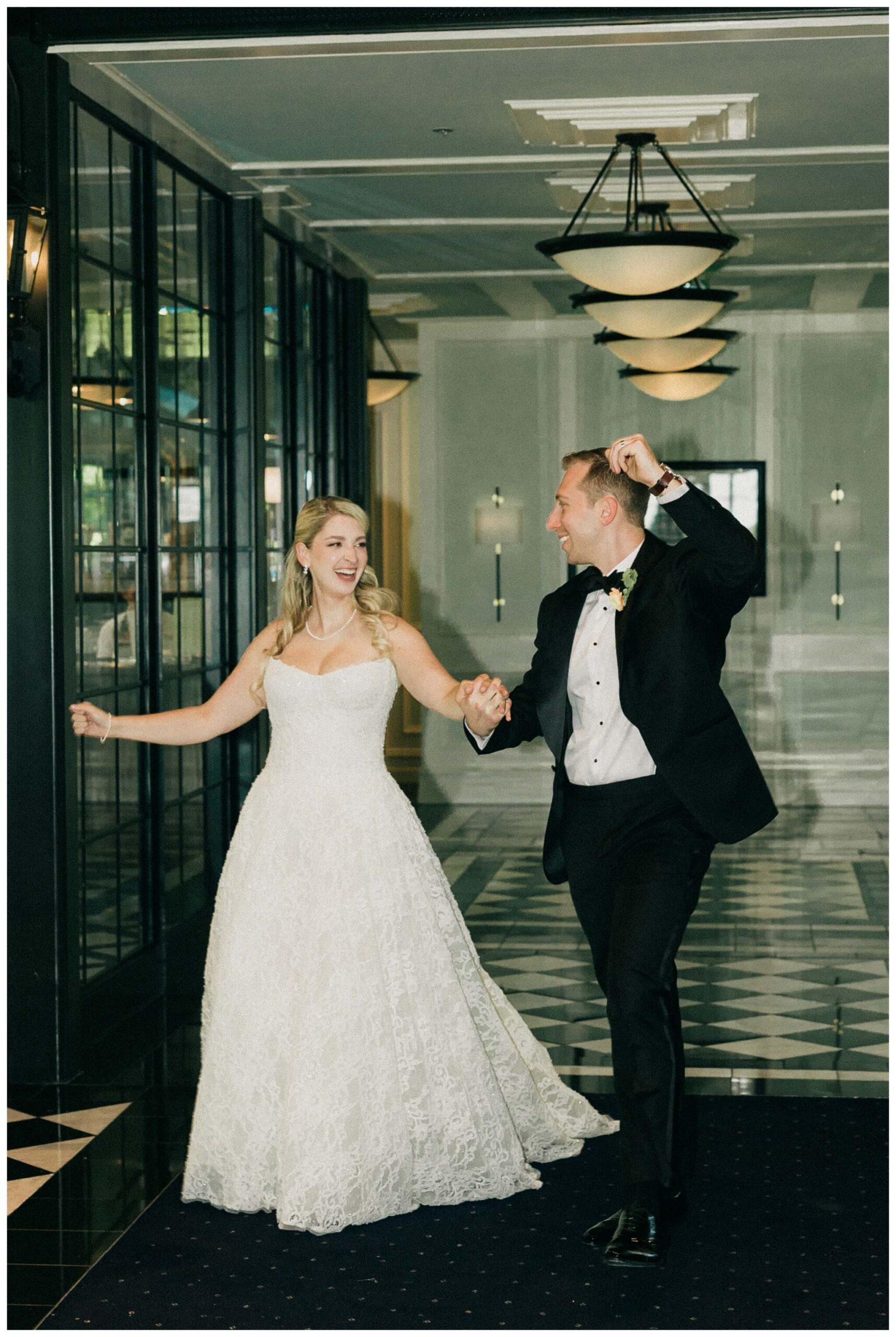 bride and groom entering reception at Shepherd's hollow golf club near clarkston michigan by josh and andrea photography 