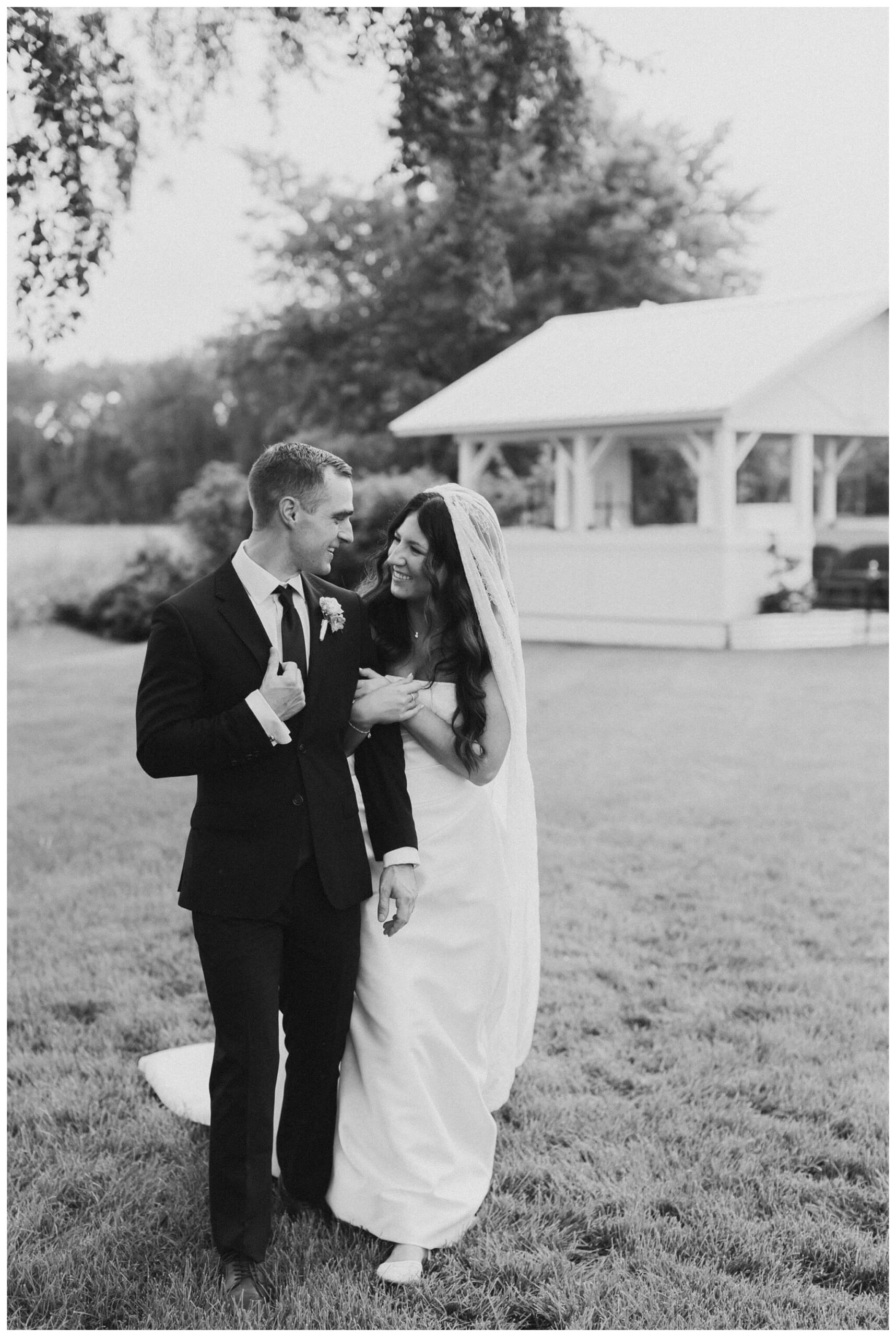 bride and groom portrait at white barn wedding at etre farms by josh and andrea photography 