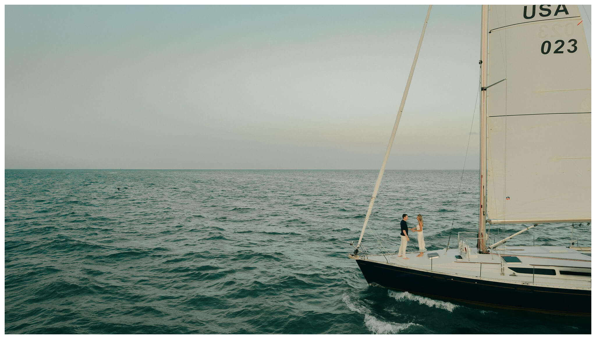 drone photo for sailboat engagement session in detroit by josh and andrea photography 