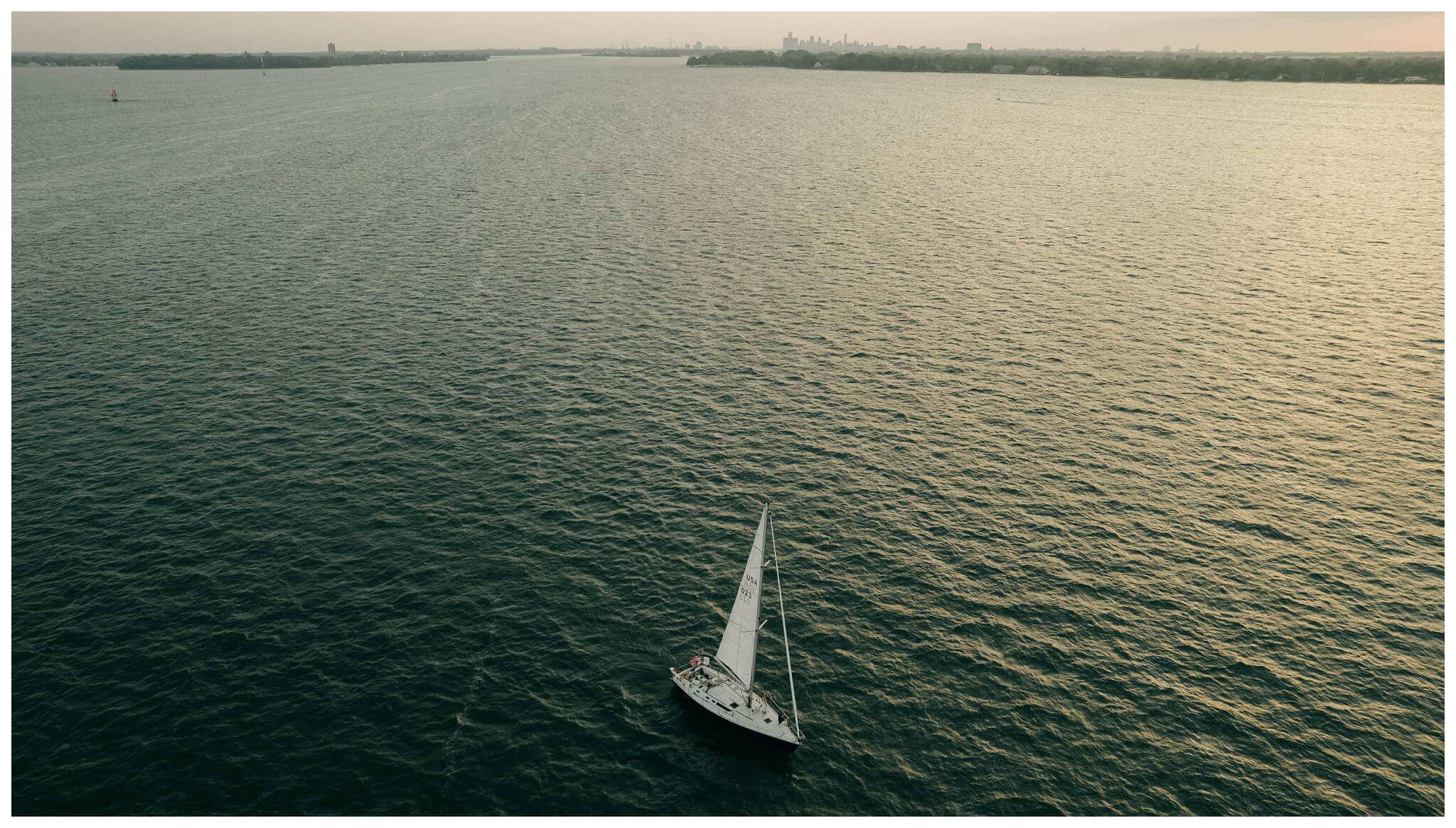 drone photo for sailboat engagement session in detroit by josh and andrea photography 