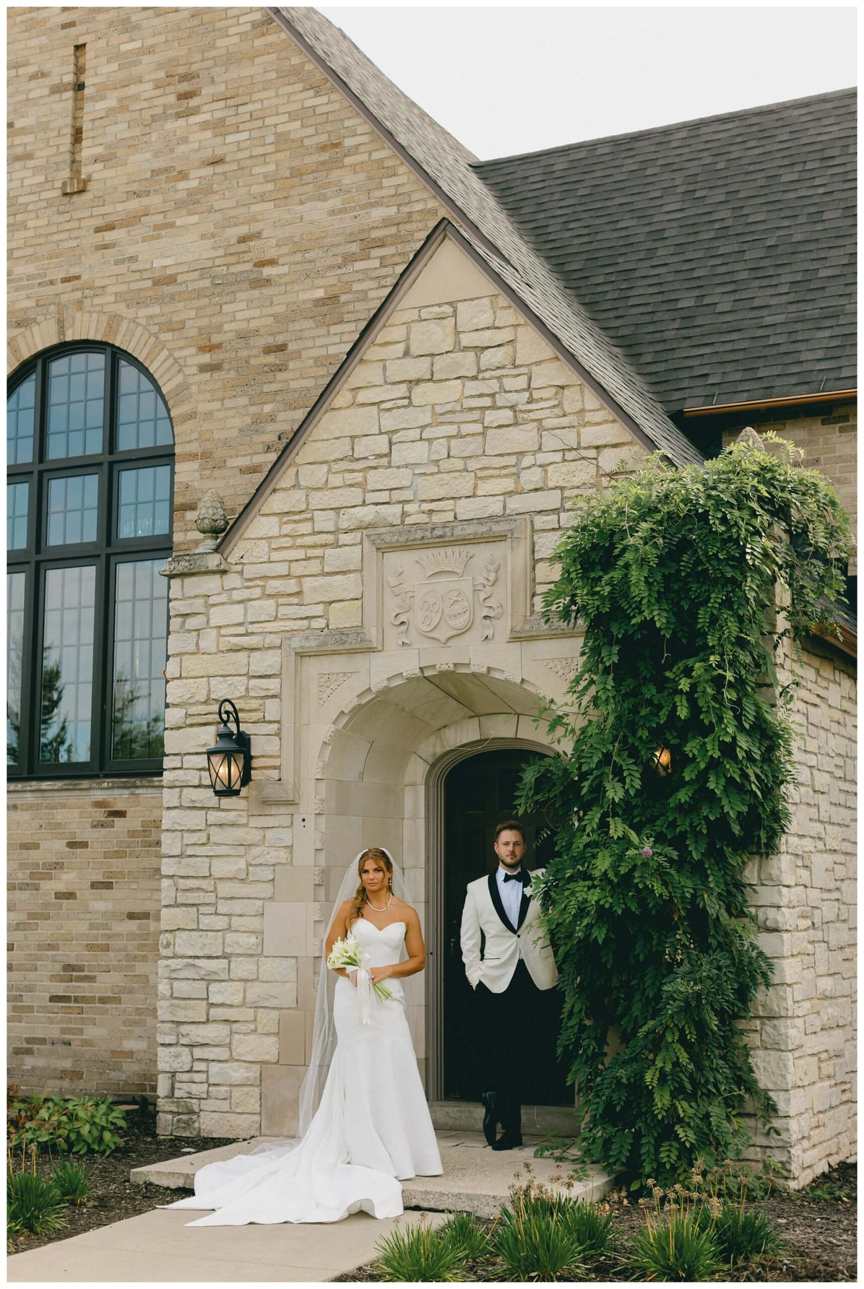 bride and groom standing in front of venue3two wedding by josh and andrea photography