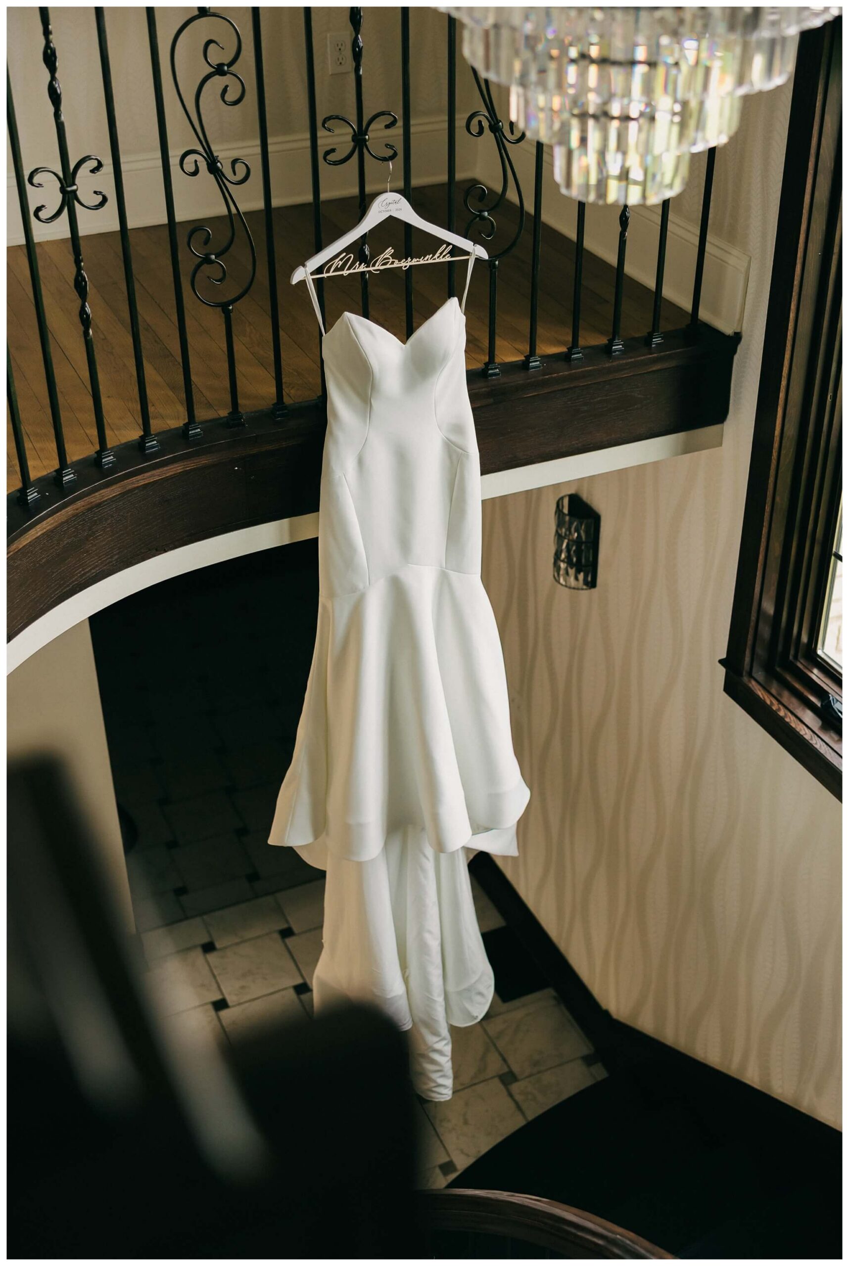 dress hanging portrait at venue3two wedding by josh and andrea photography