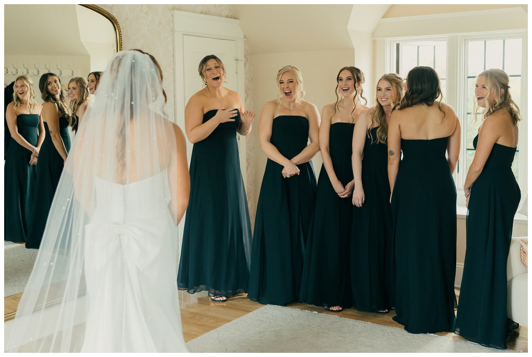 bridesmaids share first look with bride at venue3two wedding by josh and andrea photography