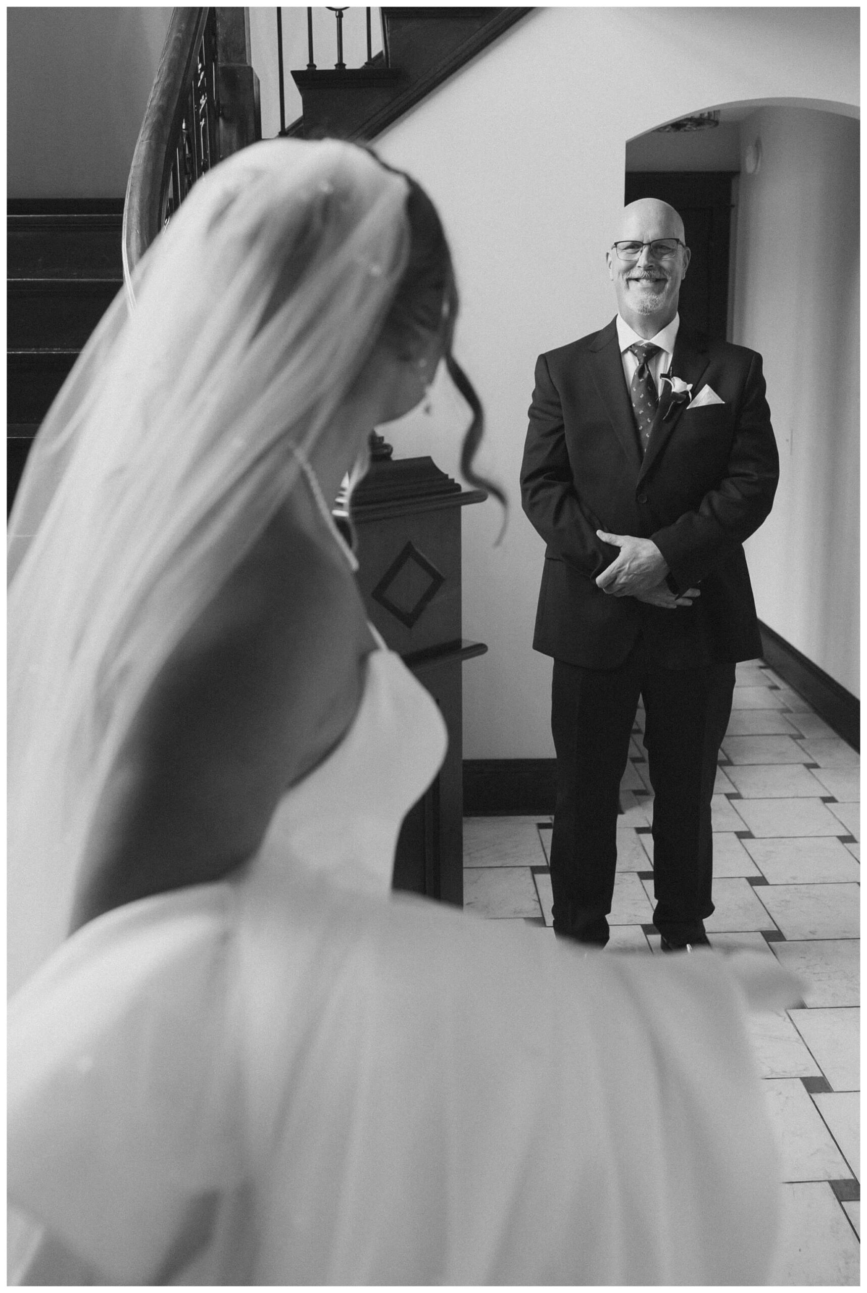 bride shares first look with father at venue3two wedding by josh and andrea photography